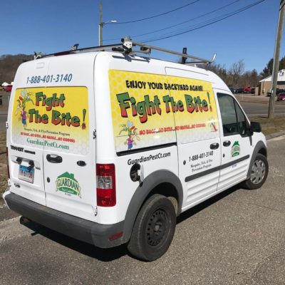 A White Color Van With Fight the Mite Printing