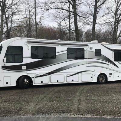 The Side of a White Color Bus With Grey Details