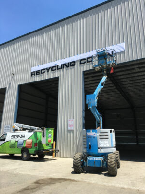 A Calmari Sign Printing in Progress With Cranes