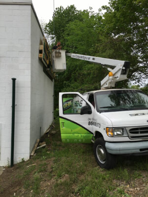 A Sign Truck With a Crane for Installation