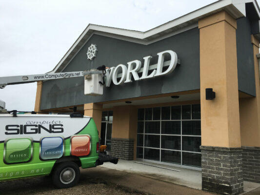 A Sign Installation in Progress on a Building