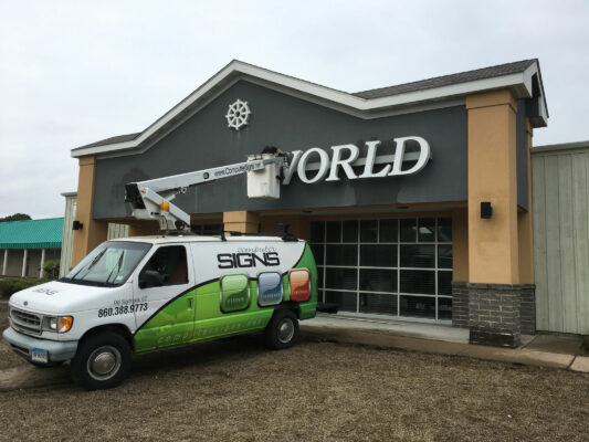 A Sign Installation in Progress on a Building