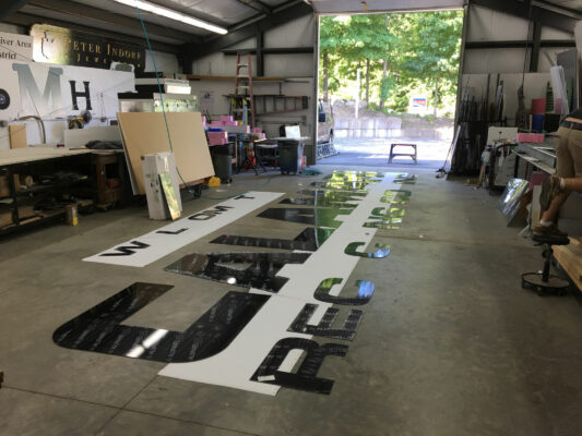 A Calmari Sign Printing in Progress on a Floor