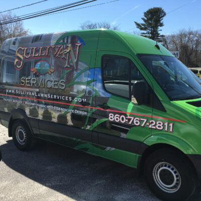 A Sulli Van Services Printed on a Van