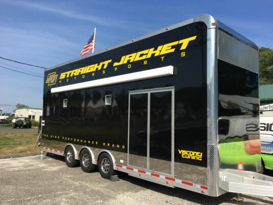 A Straight Jacket Truck With Branding Side