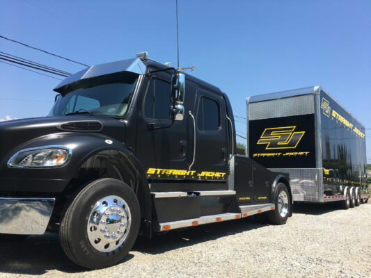 A Straight Jacket Truck With Branding Side