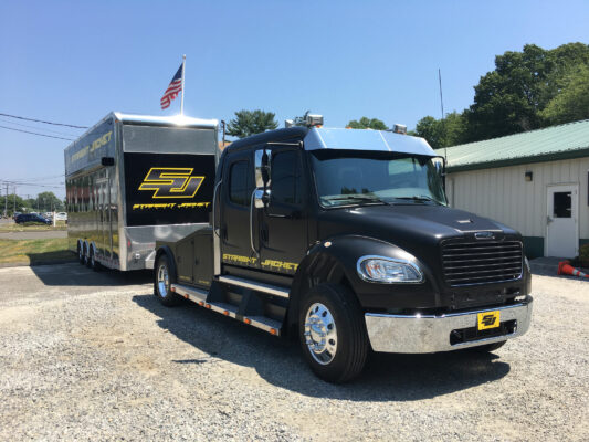 A Black and Grey Truck With Branding