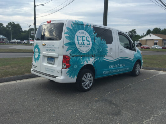 A White Color Van With EFS Printed