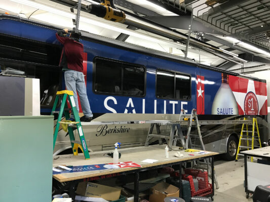 The Side of Salute American Bus in Blue Color