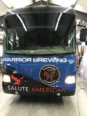 The front of a Warrior Brewing Company Bus