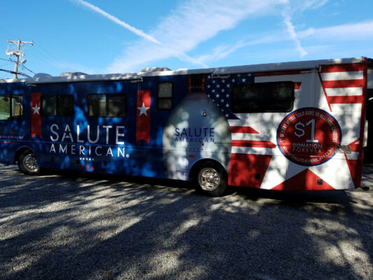 A Salute American Printed on a Bus