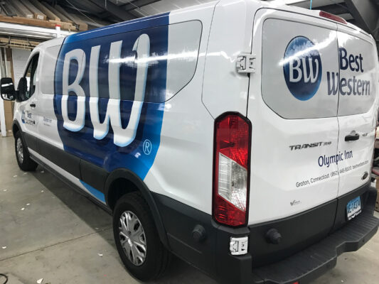 The Back of a Vehicle With Best Western Printed