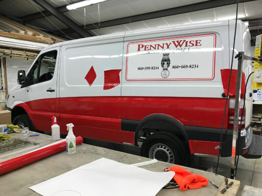 A Van in White and Red With Penny Wise Printing