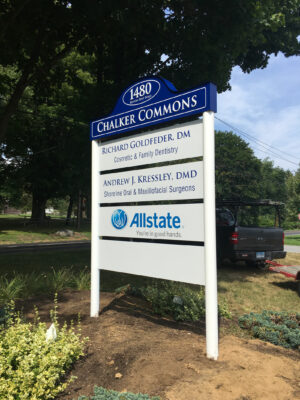 A Chalker Commons Sign Placed in Blue and White Outside