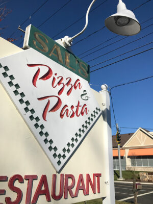 A Pizza Pasta Restaurant Sign in Red Color