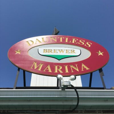 Dauntless Marina Logo in Red and Yellow