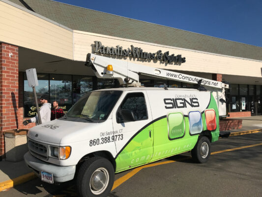 A Sign Installation Company in White and Green