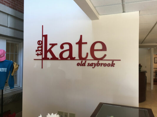 The Kate Sign in Red on a Cream Background