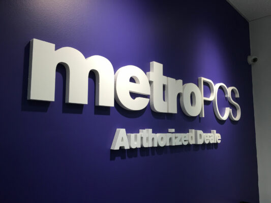 A Metro PCS Sign on a Blue Background