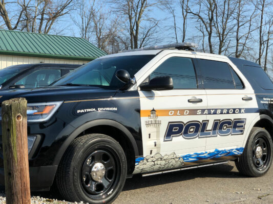 A Police Vehicle of Old Saybrook Printing on the Door