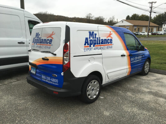 The Back of a White Van With Blue and Orange Details