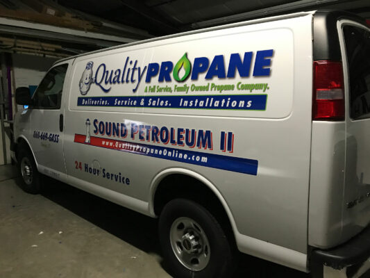 The Side of a Van With Quality Propane Logo