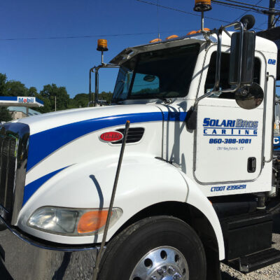 A Door of a Large Truck in White and Blue