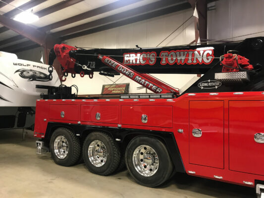 The Side of a Towing Truck in Red Color