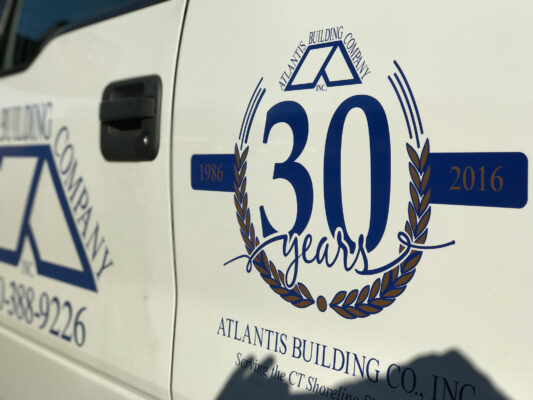 The Side of a Truck With Thirty Years Logo