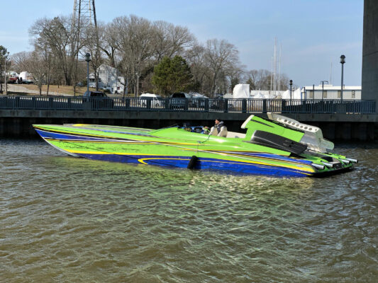 A Boat in Green and Blue on Water