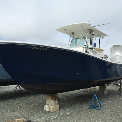 A Boat With Black Hull on Stands