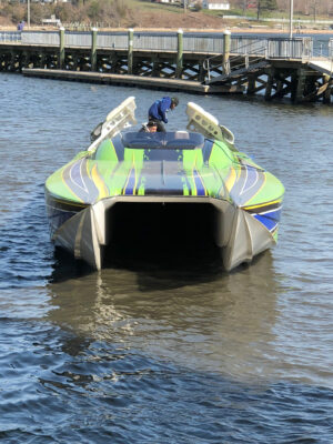 A Boat Sailing Under a Bridge of Water