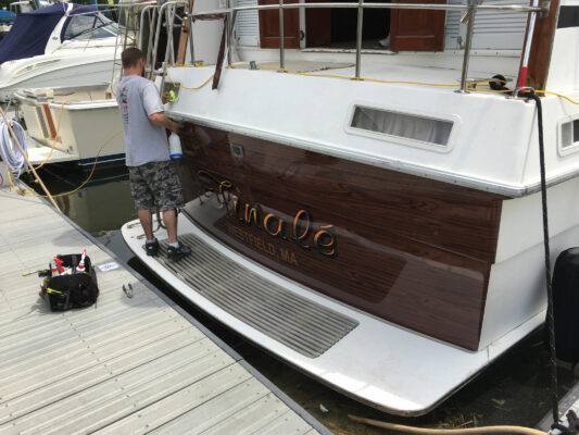 A Man Working on Printing Project of a Yacht