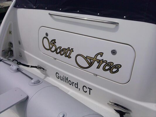 Scott Free Logo in Gold Tones on a Boat