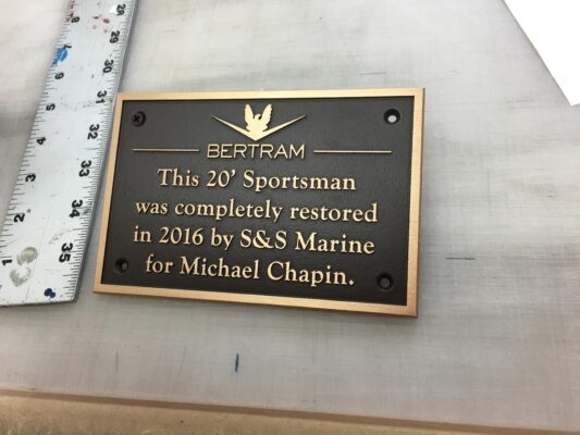 A Memorial Plaque With Golden Words