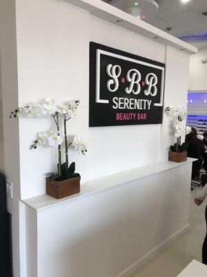 Serenity Beauty and Bar Sign Board on a Reception Area